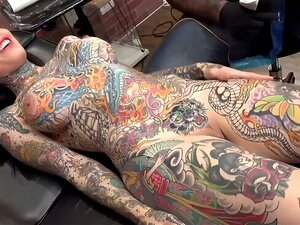 Tiger Lilly gets a forehead tattoo while nude